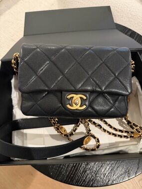 CHANEL Black Quilted Mini Flap Crossbody with Gold Hardware
